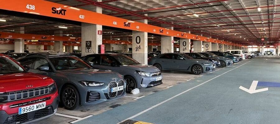 Sixt rental cars parked in a covered garage at a pick-up location